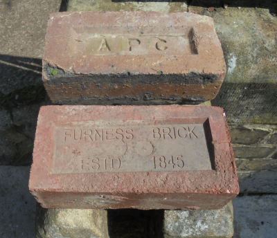 Axwell Park Colliery (APC) and one which is as described on the brick.