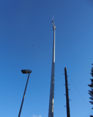 taller than the lampost, taller than the telegraph pole, but not that noticable in the streetscape.