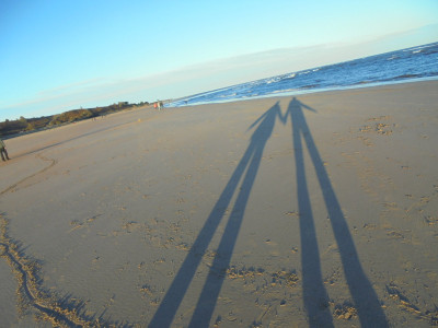 The childlike joy of long shadows on the beach
