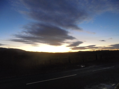 As the sky got darker the orange became<br />more vivid silhouetting black the trees and hedges and everything in the foreground but