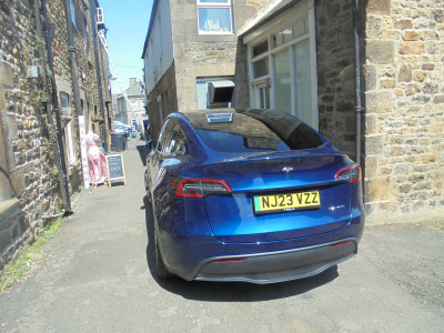 Tesla Model Y up a back street