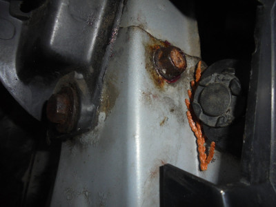 Upper radiator core support bolts<br />two each side 10mm heads, one under headlight but enough clearance to remove.<br />The Falcon choice-far easier to undo.