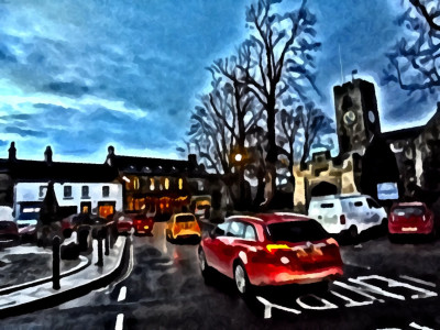 A passing yellow Fiat