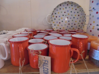 A small nest of Enamel Mugs<br />This lot have been producing them since the 1920's but probably have only just discovered orange