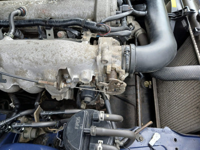 EGR valve is the black round thing just below/behind the exposed trottle cable - own work